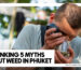 A man using a magnifying glass to inspect a jar of high-quality Weed in Phuket at Phuket High dispensary.