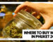 WHERE TO BUY WEED IN PHUKET 2026 - A close-up of a person's hand opening a clear glass latch jar filled with green cannabis flower at the Phuket High dispensary.