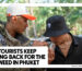 WHY TOURISTS KEEP COMING BACK FOR THE BEST WEED IN PHUKET - Two young men standing outdoors in a lush environment, with one holding a clear glass jar of cannabis while the other leans in to smell it.