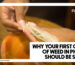 WHY YOUR FIRST GRAM OF WEED IN PHUKET SHOULD BE SMALL - A close-up of a person's hands carefully holding a translucent rolling paper filled with ground cannabis over an orange tray.